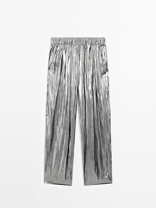 Flowing metallic trousers with gathered detail