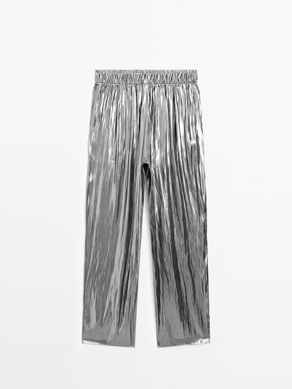 Flowing metallic trousers with gathered detail