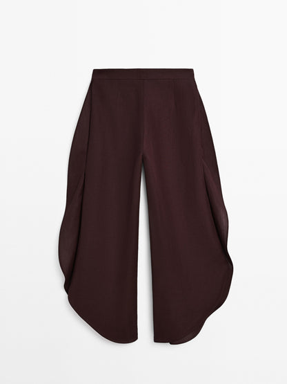 Flowing trousers with side vents