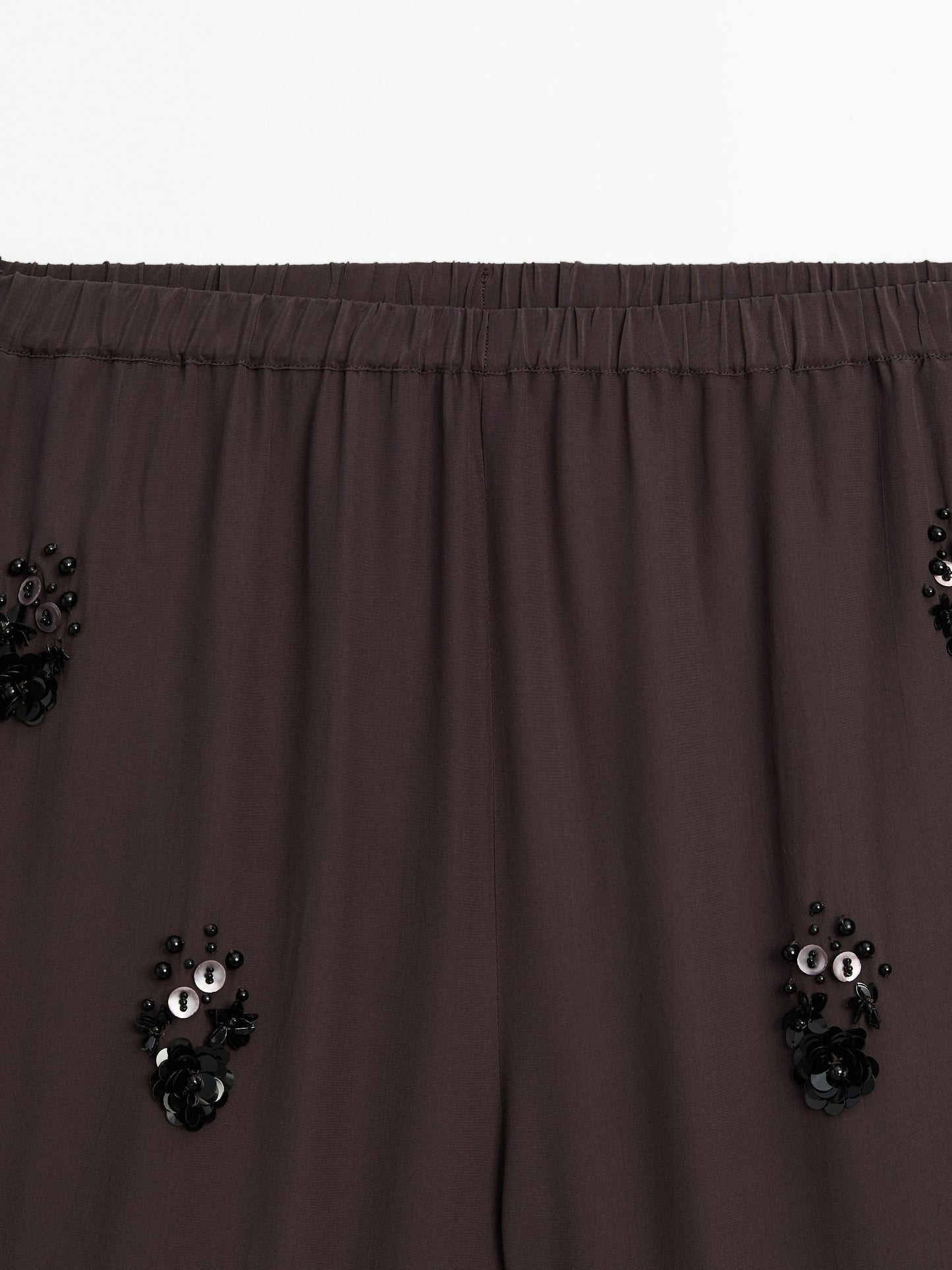 Flowy trousers with floral appliqué
