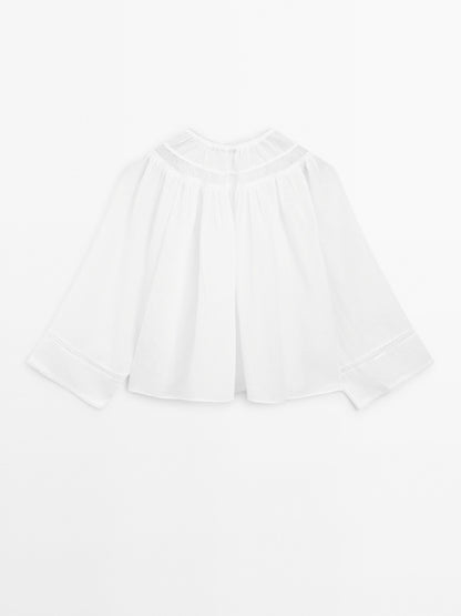 Flowing blouse with lace detail