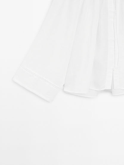 Flowing blouse with lace detail