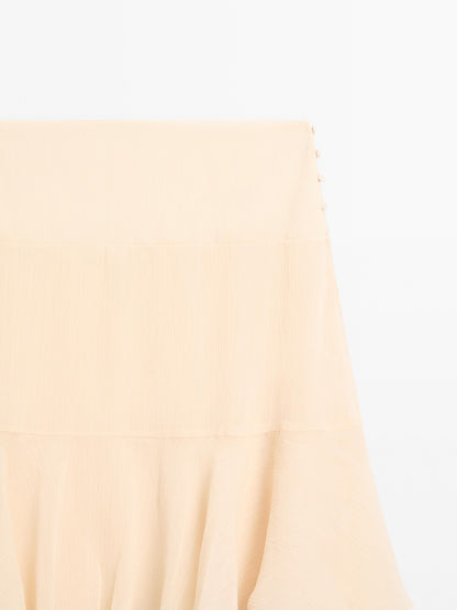 Long ruffled skirt with sash