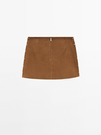 Suede leather mini skirt with eyelets