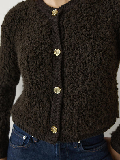 Bouclé cardigan with rhinestone button