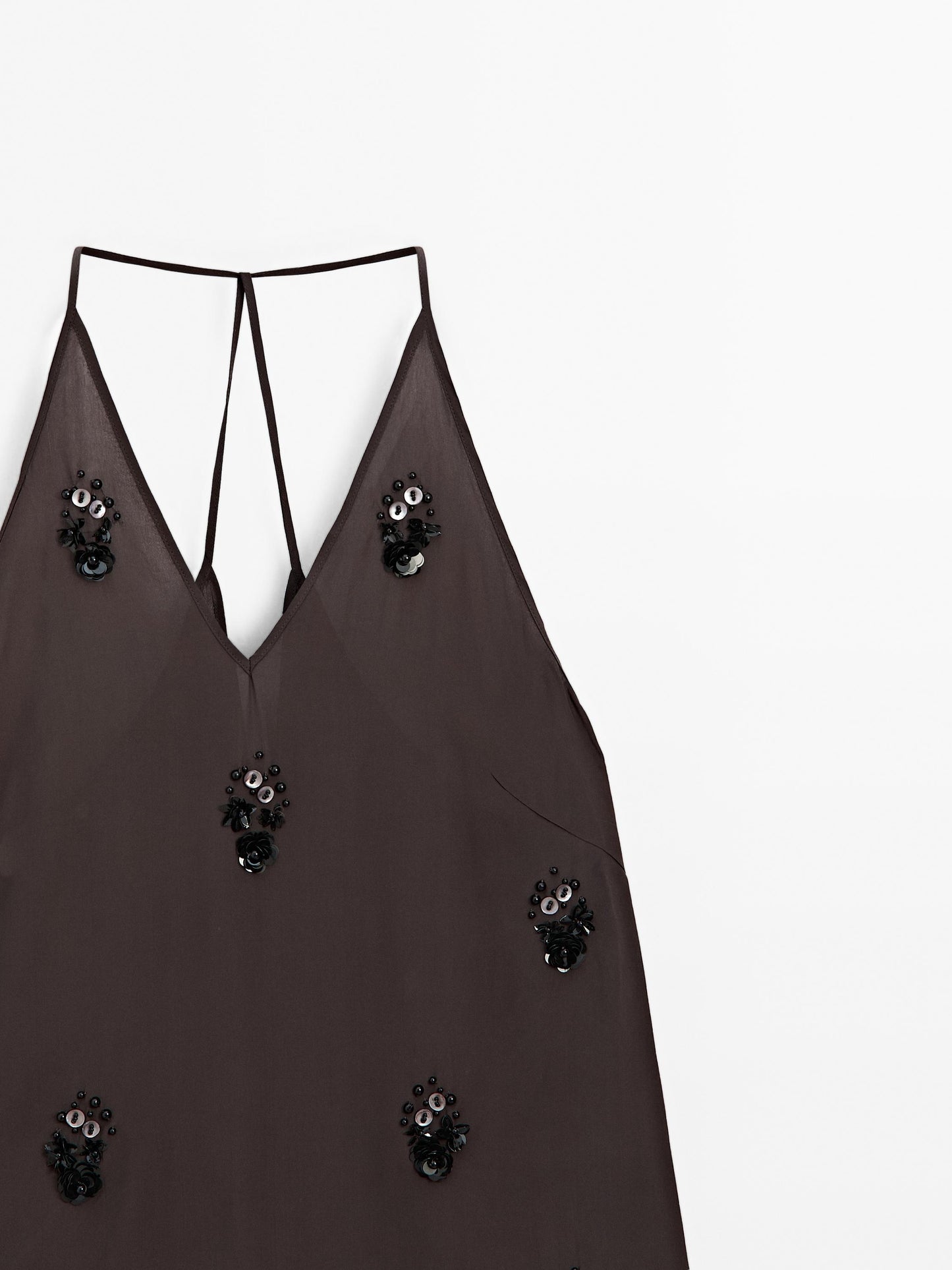 Flowy top with floral appliqués