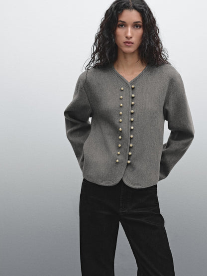 Jacket with ball button fastening