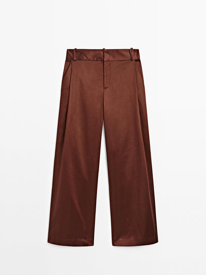 Shiny trousers with dart details