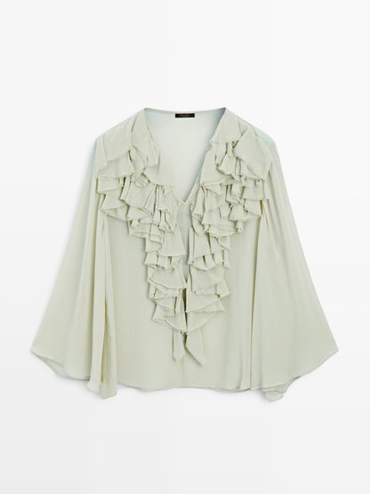 Flowing blouse with ruffled neckline