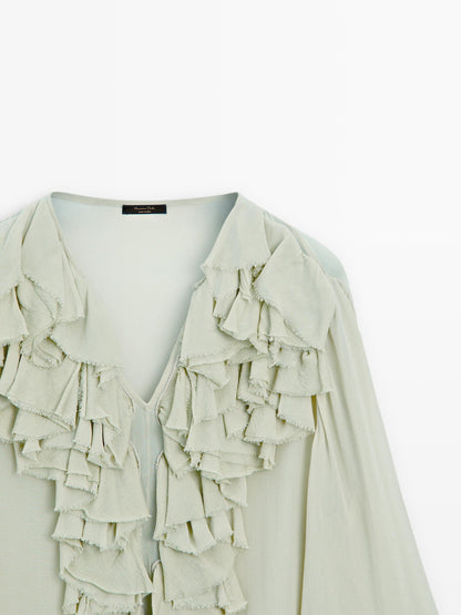 Flowing blouse with ruffled neckline