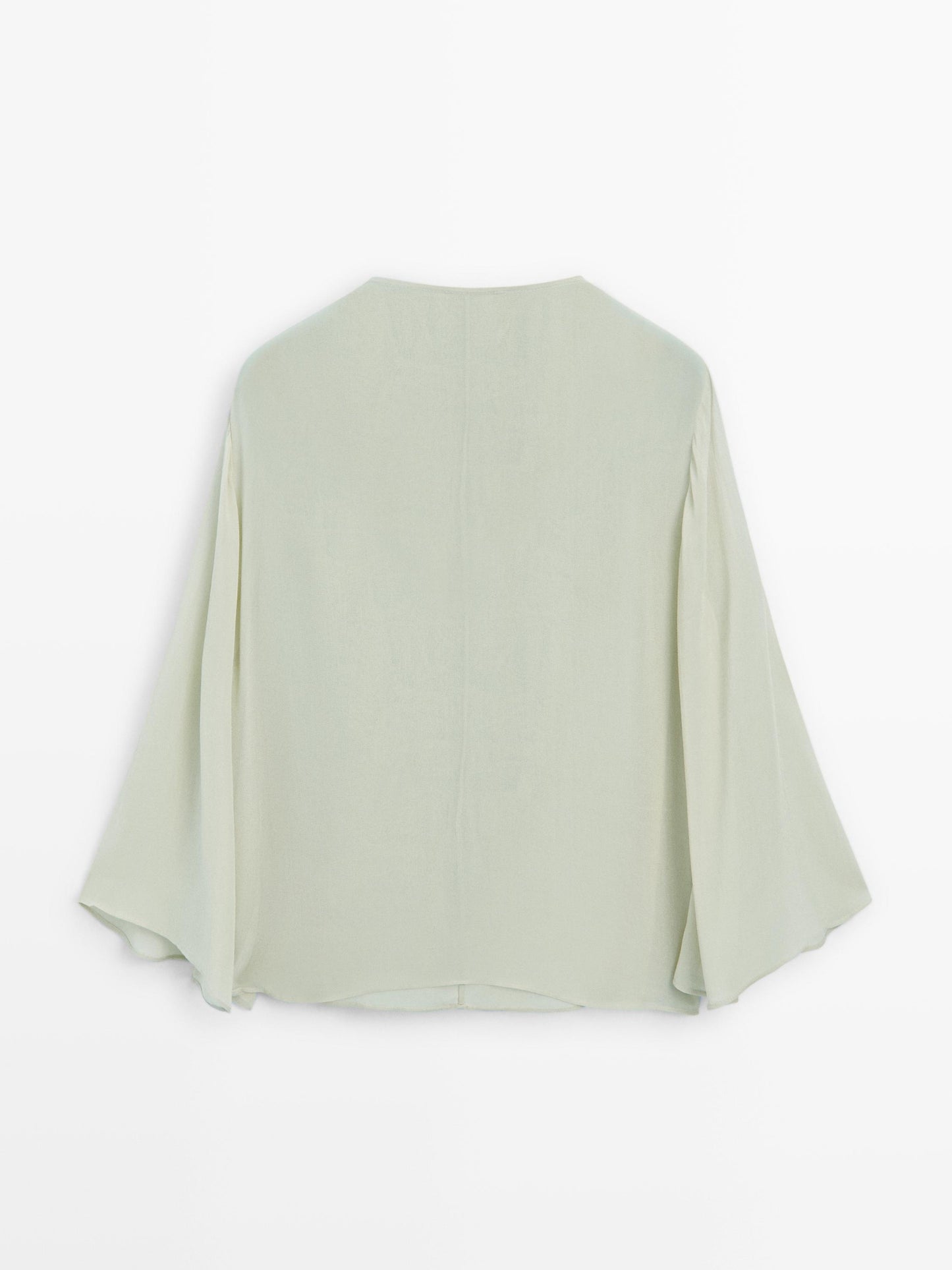 Flowing blouse with ruffled neckline