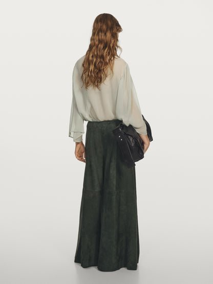 Flowing blouse with ruffled neckline