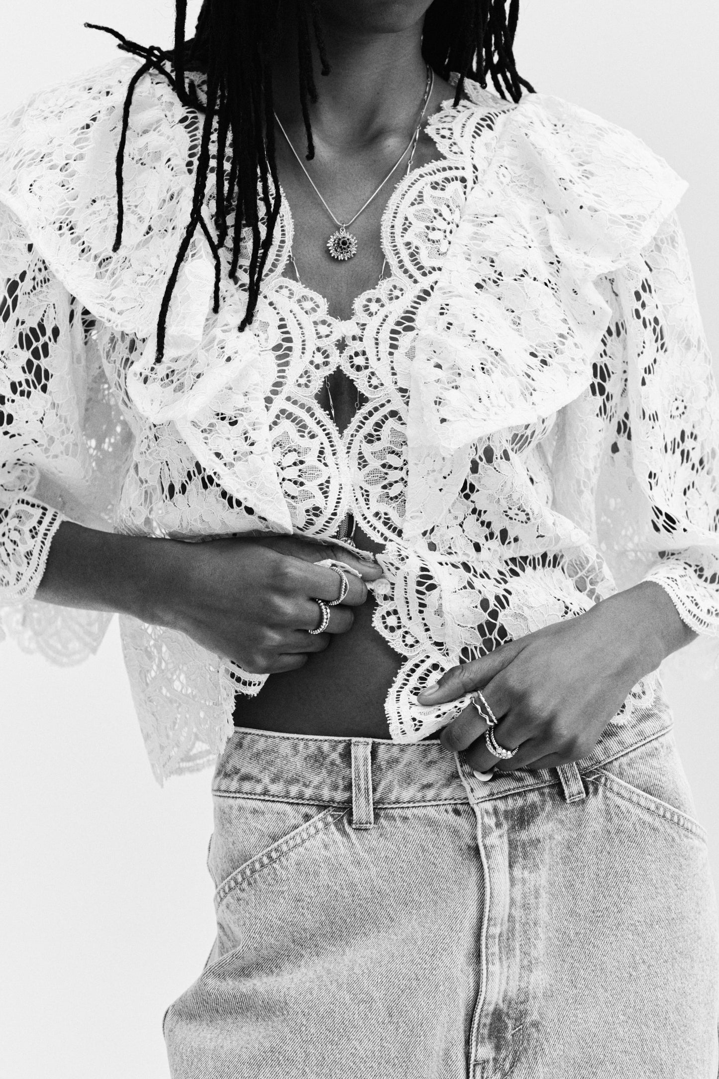 Flounce-trimmed lace blouse