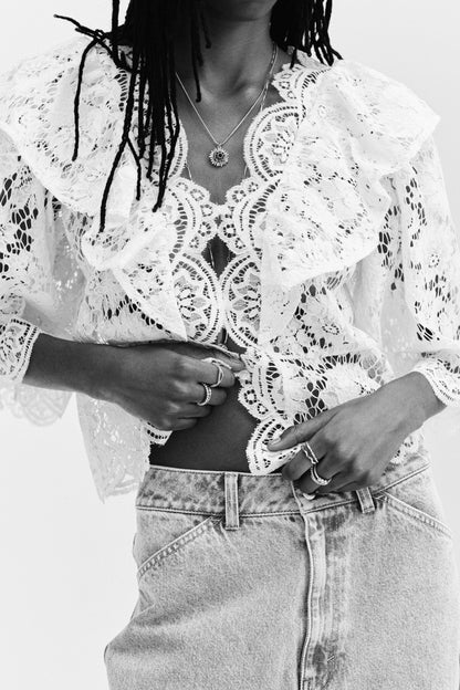 Flounce-trimmed lace blouse