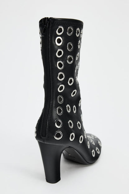 Heeled ankle boots with metal eyelets