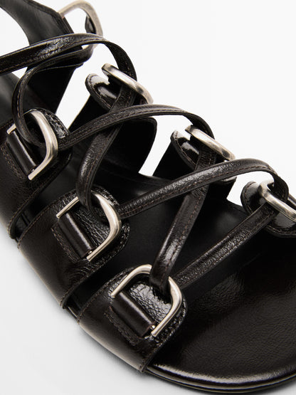 Lace-up sandals with rings