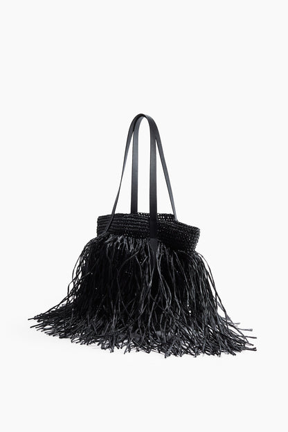 Fringed straw handbag