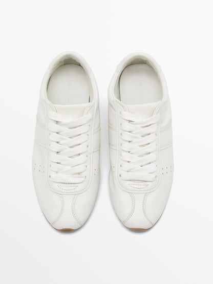 Soft trainers with flap detail