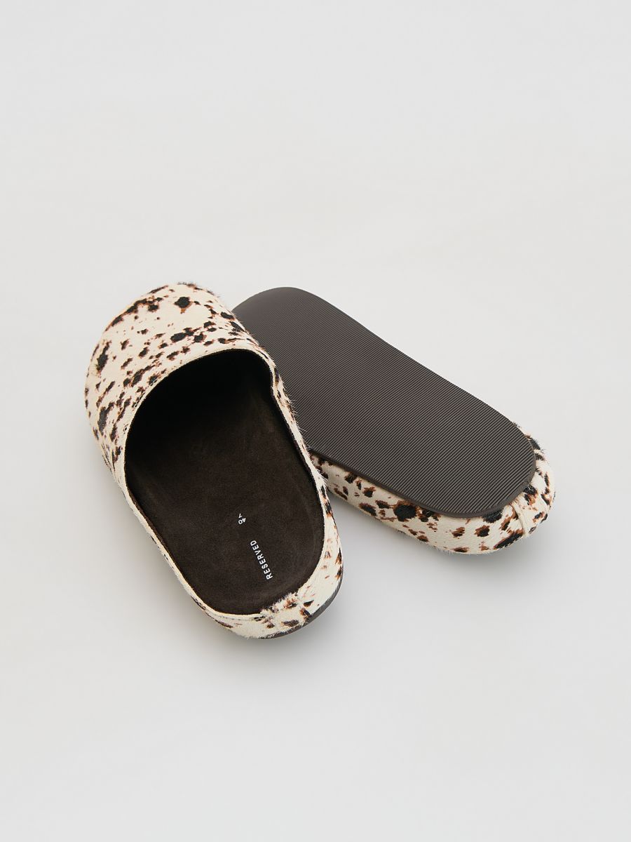 Leather mules with animal motif