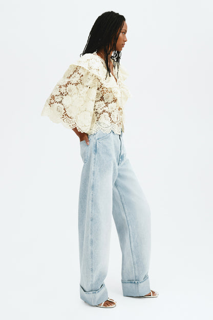 Flounce-trimmed lace blouse