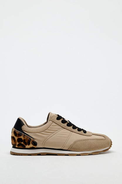 Running trainers with animal print heel tab