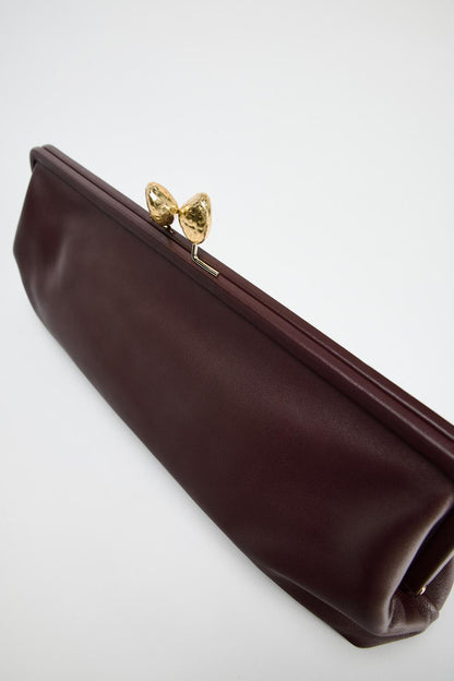 Leather clutch bag with metal detail