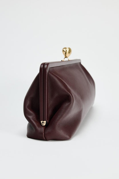 Leather clutch bag with metal detail