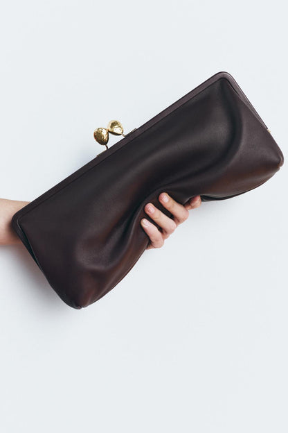Leather clutch bag with metal detail