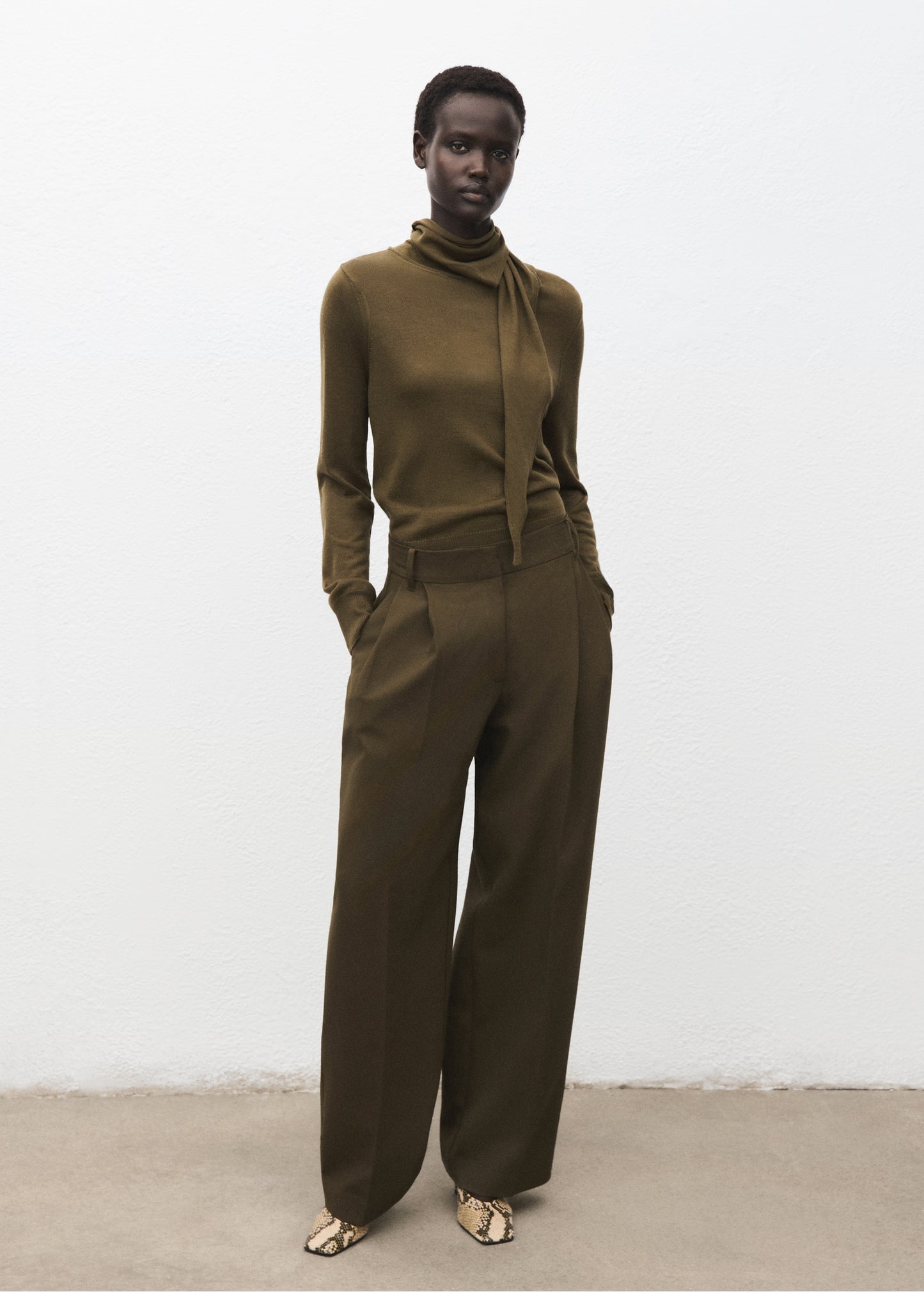 Knotted turtleneck sweater