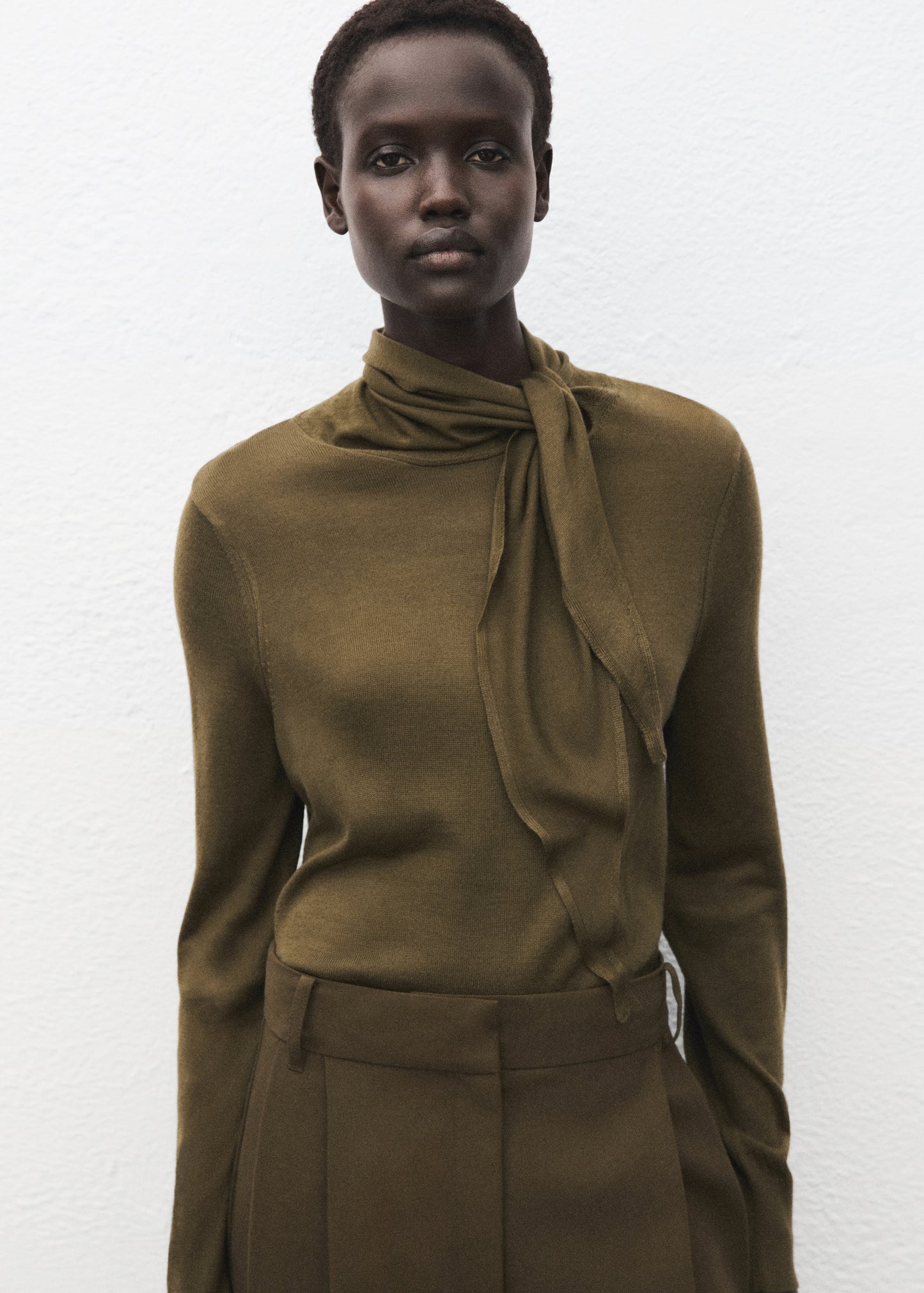 Knotted turtleneck sweater