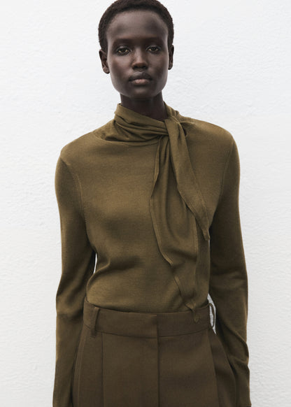 Knotted turtleneck sweater