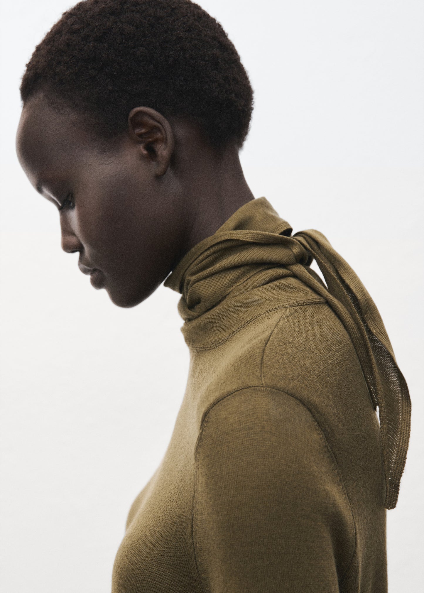 Knotted turtleneck sweater
