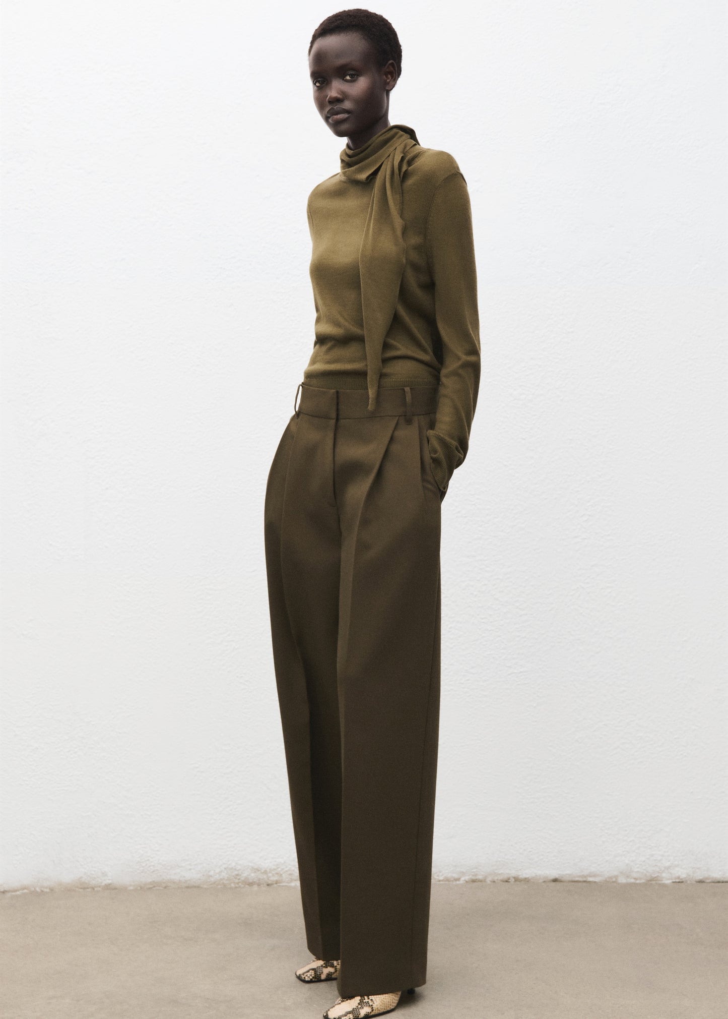 Knotted turtleneck sweater