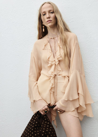 Ruffled blouse with flared sleeves