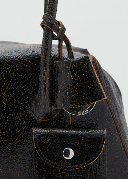 Leather shoulder bag with charms