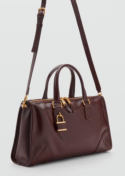 Bag with shiny finish and handles