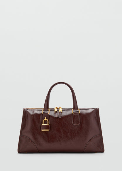Bag with shiny finish and handles