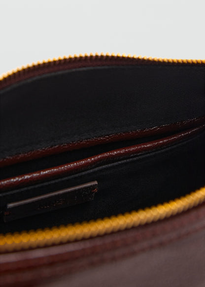 Bag with shiny finish and handles