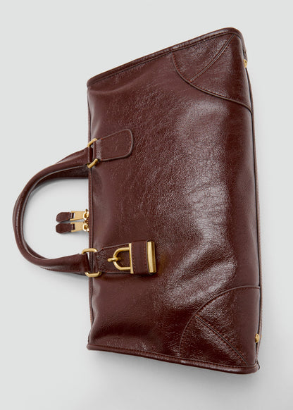 Bag with shiny finish and handles