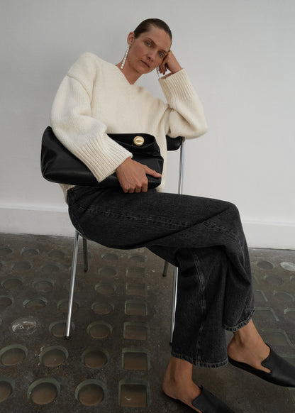 Leather clutch bag with metallic detail