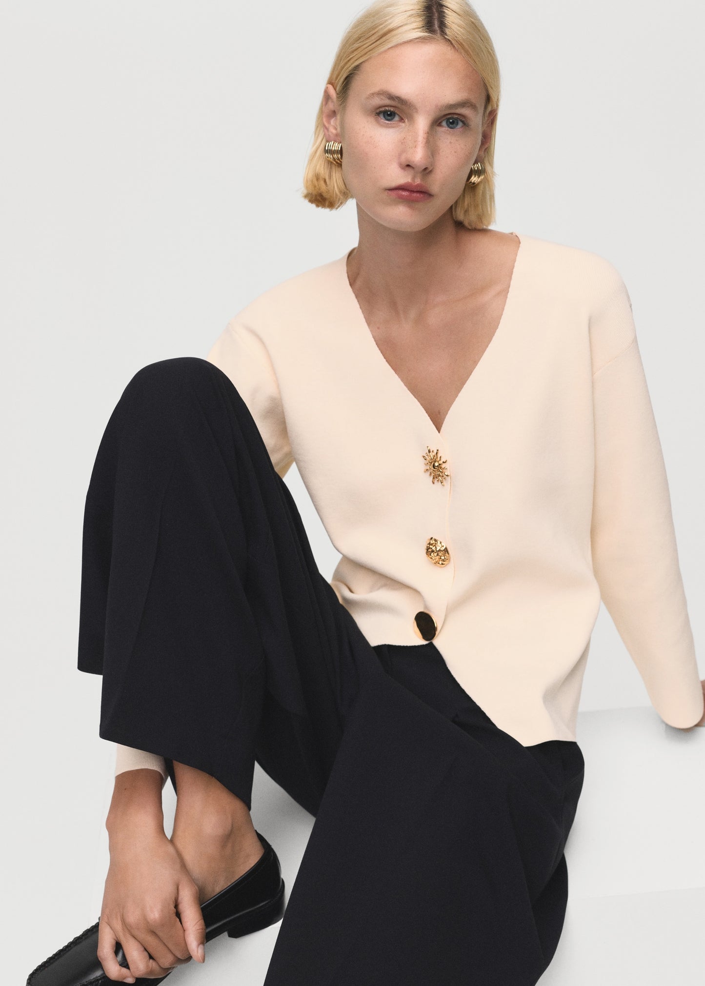 Knitted jacket with jewel buttons