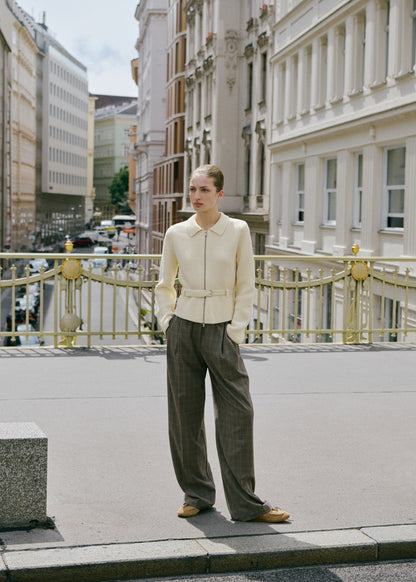 Knitted jacket with belt buckle