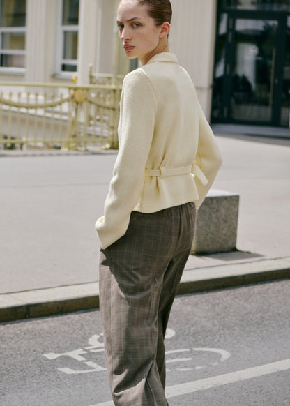 Knitted jacket with belt buckle