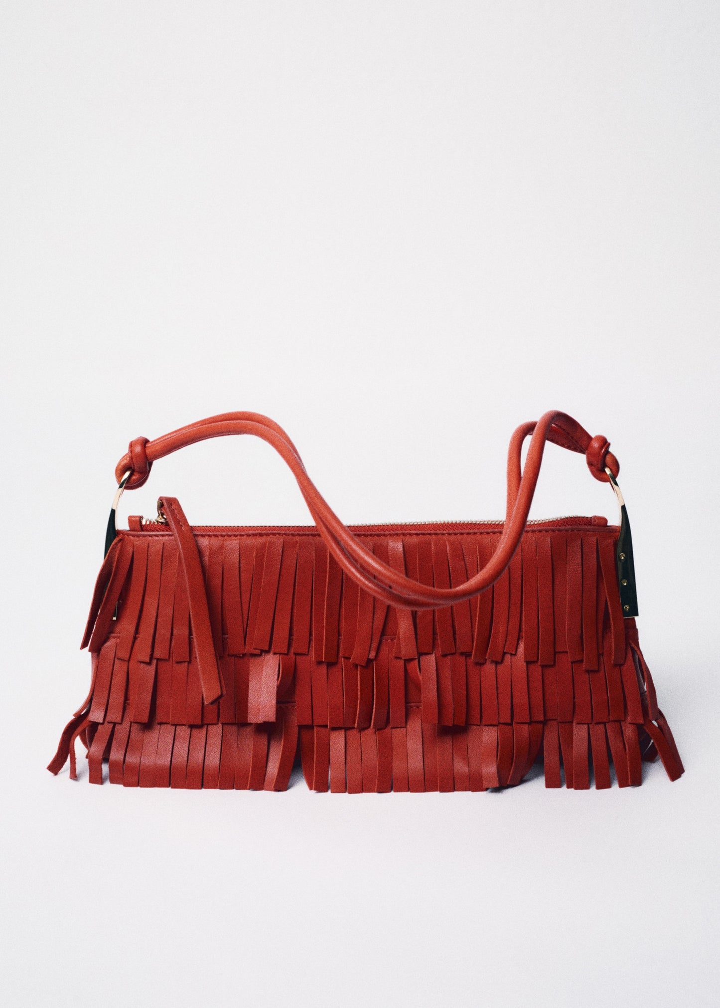 Leather shoulder bag with fringes
