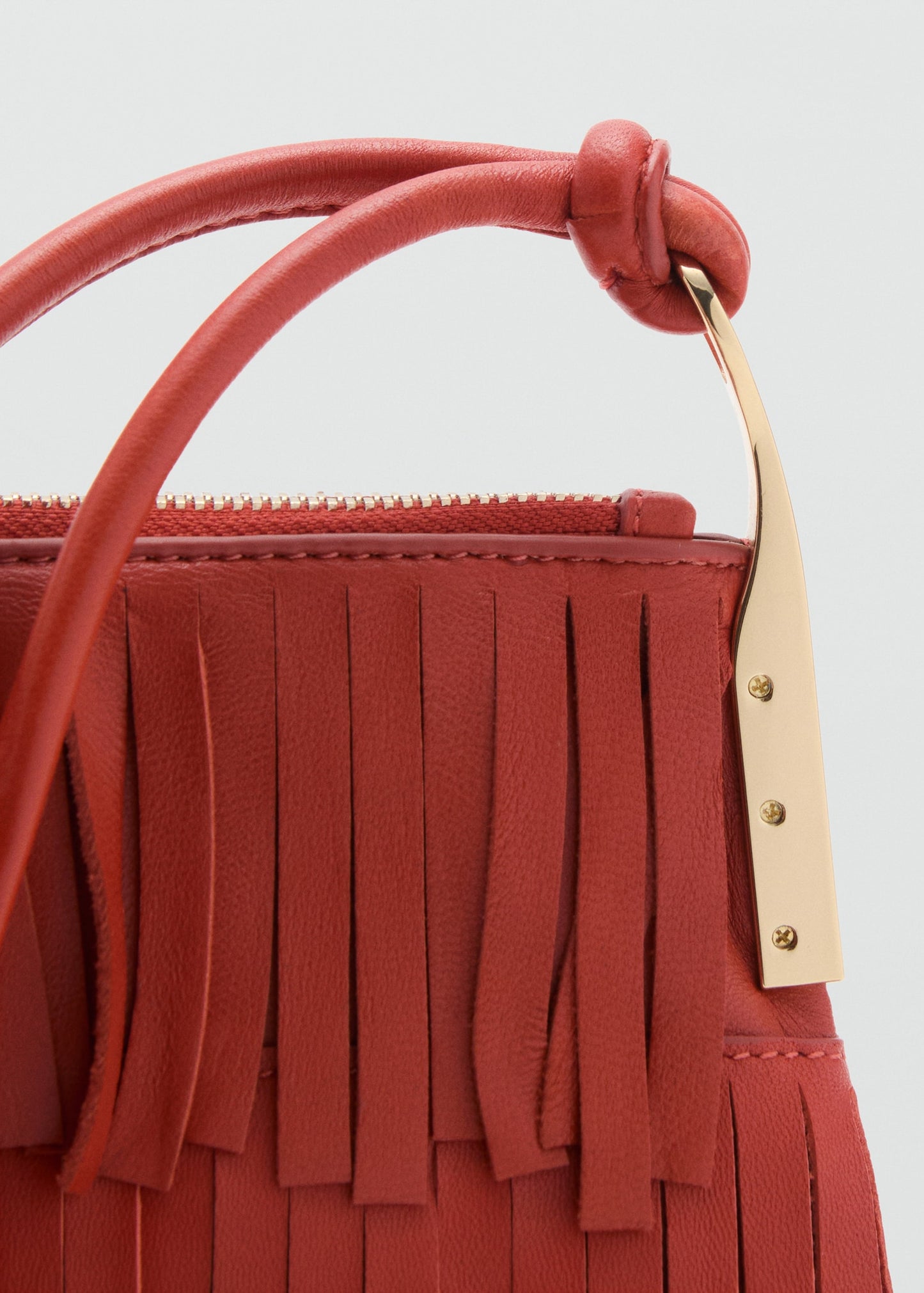 Leather shoulder bag with fringes