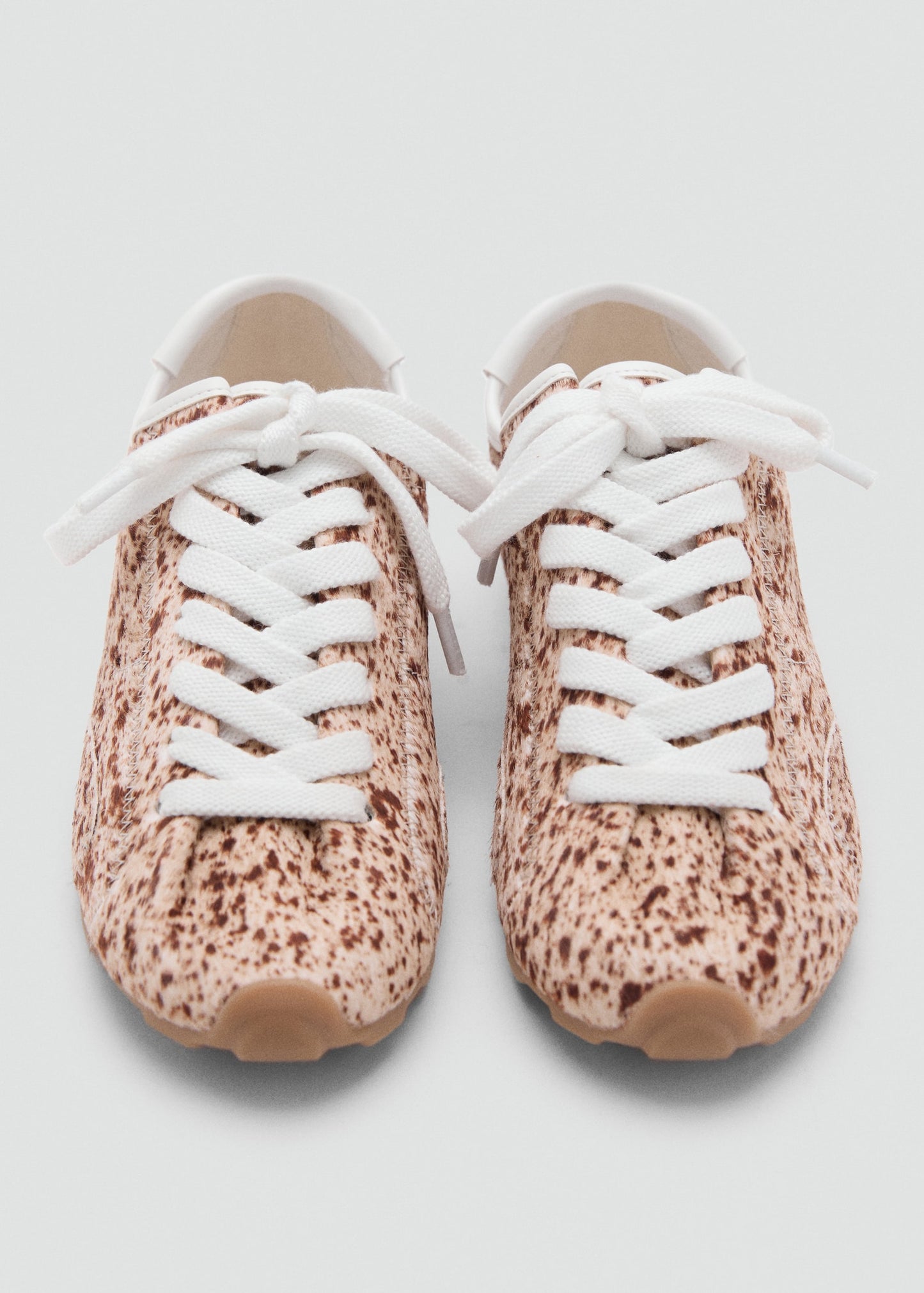 Leather and fur-effect trainers
