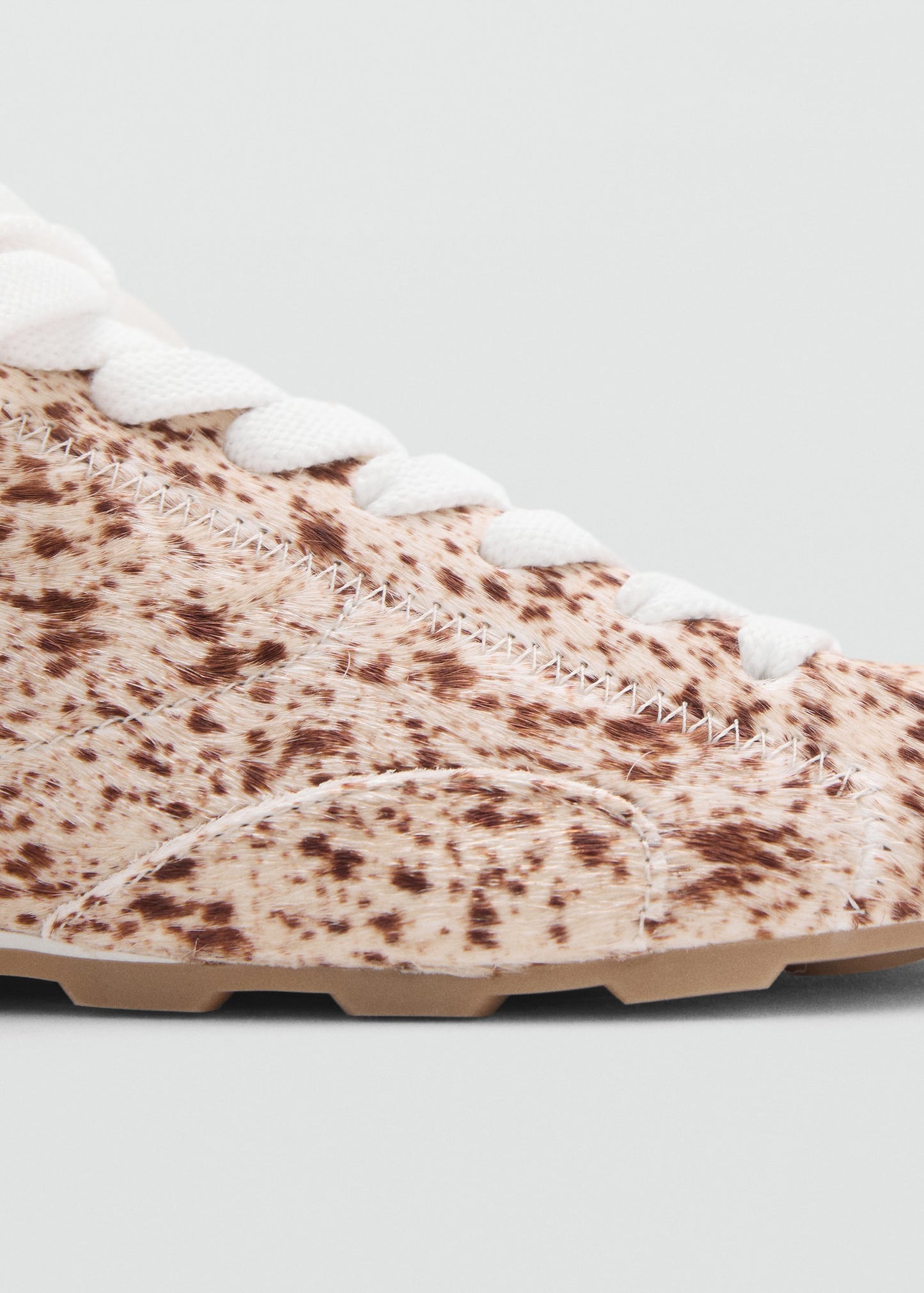 Leather and fur-effect trainers