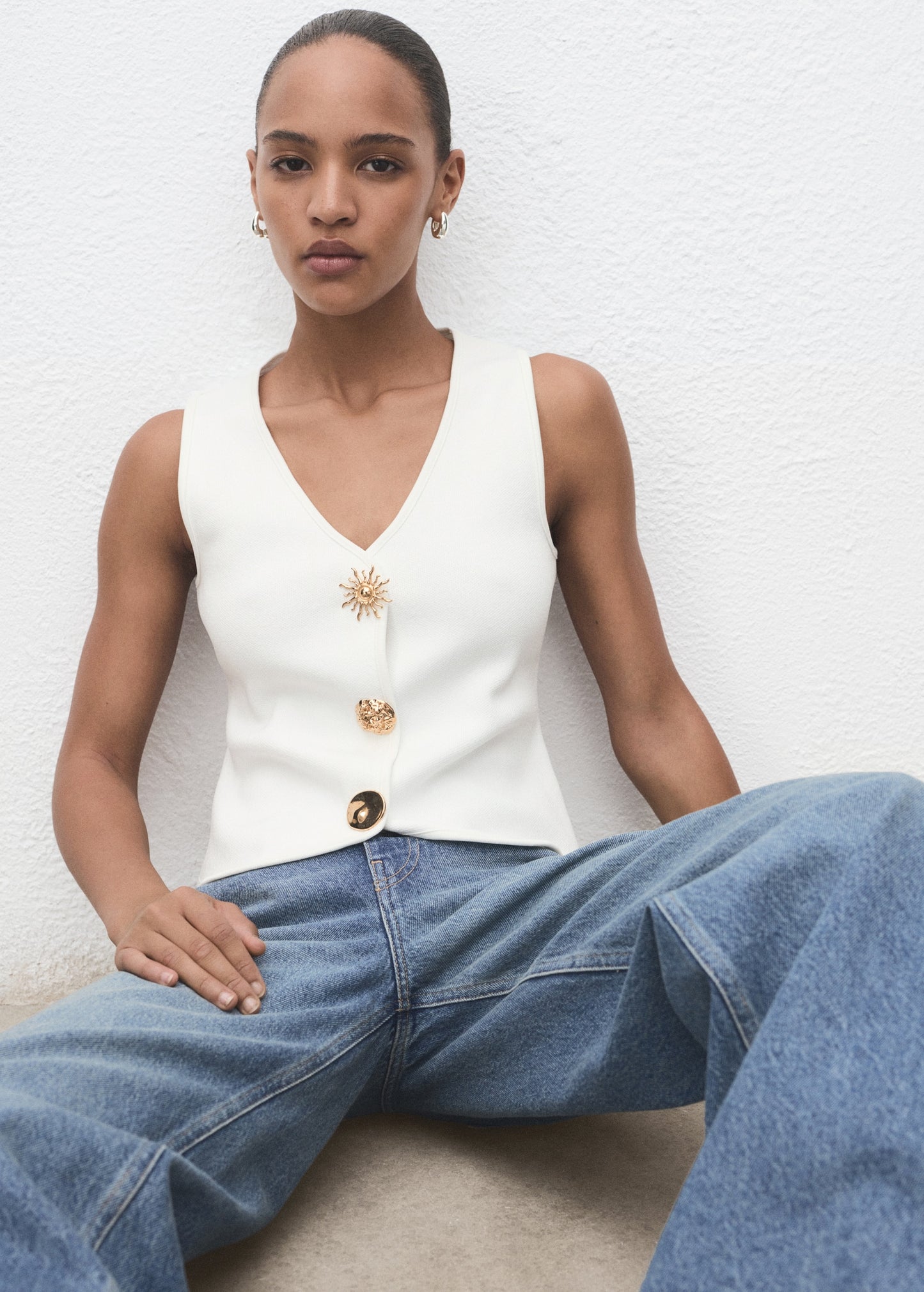 Knitted waistcoat with jewel buttons