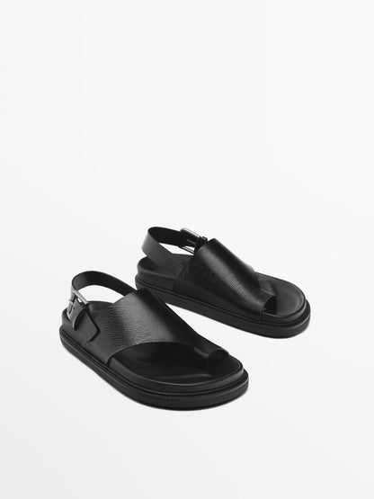 Asymmetric flat sandals