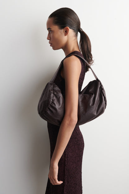 Textured-Leather Cylinder Clutch Bag